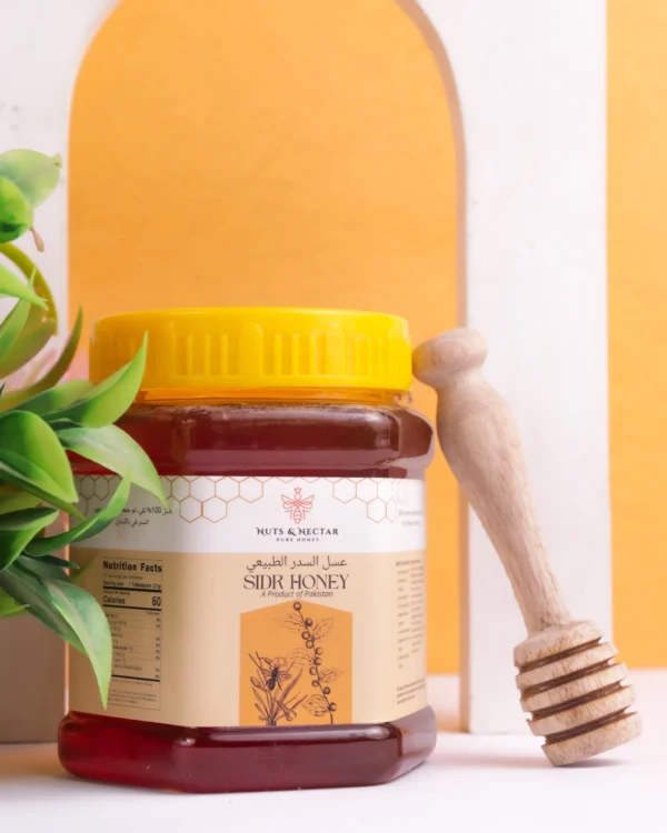 Sidr Honey with Wooden Dipper Closed jar of Sidr Honey with wooden honey dipper – Nuts & Nectar Pakistan